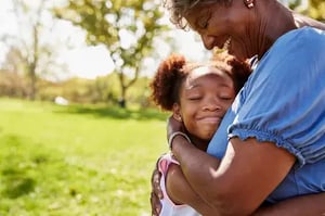 Woman_Girl_Black_30s-40s_Hugging_Park