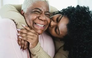 Woman_Man_Black_20s-30s_Hugging_Home