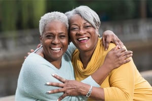 Women(2)_Black_60s-70s_Hugging_OutdoorsPark