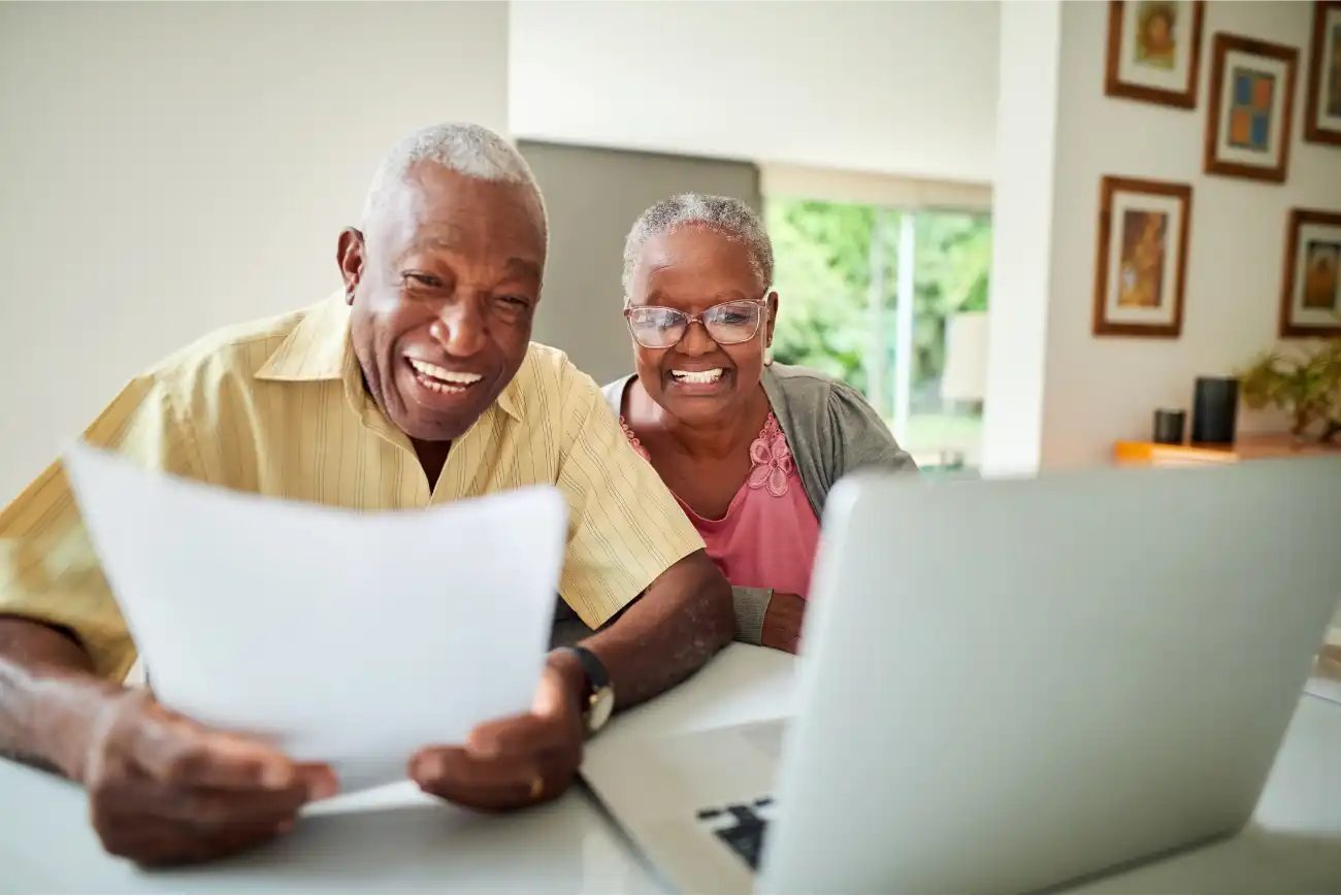 Man_Woman_Black_60s-70s_ReviewingDocuments_HomeOffice